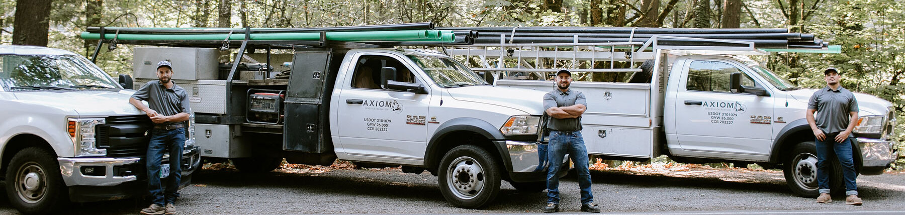 Axiom Sewers & Plumbing Crew with their trucks